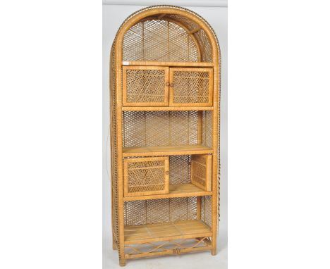 A retro vintage 20th Century bamboo and cane worked domed top cabinet having three open section interspersed with twin door c