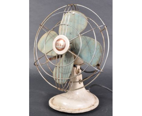 Revo - A retro 20th Century desk fan having wire worked cage raised on a cream metal base. Sold as untested. Measures approx;