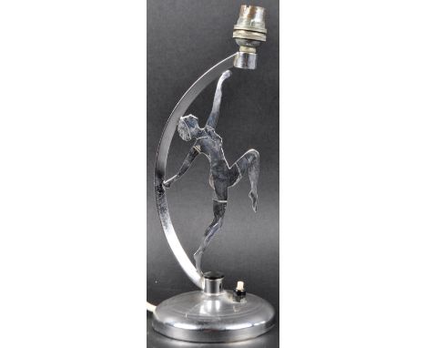 A vintage 20th Century Art Deco chromed brass table / desk lamp light having a crescent stem with central plate depicting a d