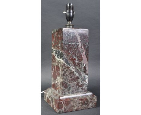 A vintage 20th Century Art Deco red marble table lamp light having a bakelite fitting atop a rectangular marble column raised