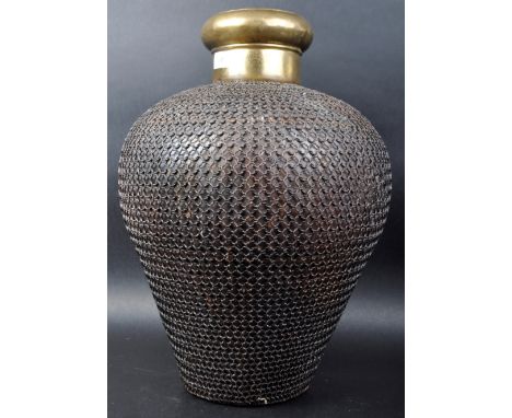 A large vintage 20th Century iron and brass floor standing jar / vase vessel having a brass rim with bulbous tapering body ha