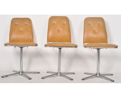 Peak Furniture - A matching set of three retro mid 20th Century 1960s swivel dining chairs having padded PVC tan brown uphols