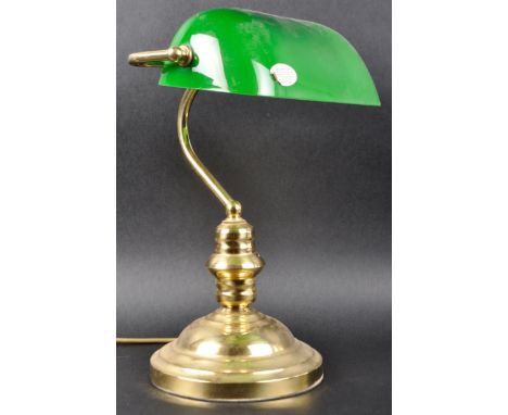 A 20th Century 1980s English bankers desk / table lamp light of brass construction having an adjustable green glass shade sup