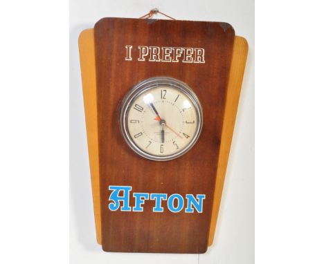 Afton - A vintage mid 20th Century advertising walnut veneered hanging clock having a central clock face with chrome case. Th