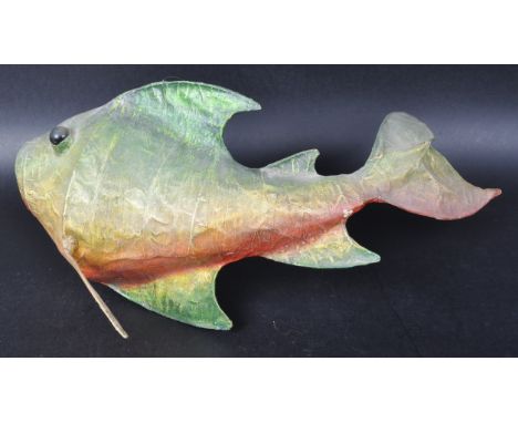 A retro vintage 20th Century paper mache abstract model of fish finished in green and yellow with red flecks to the underside