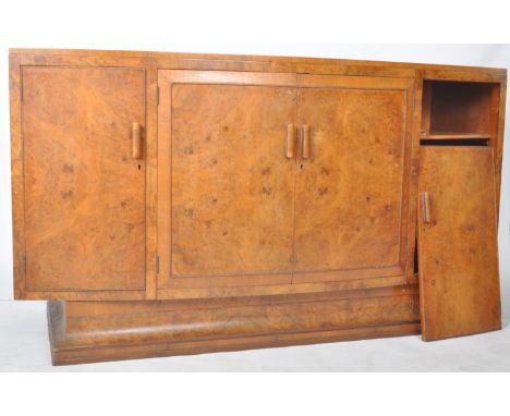 A vintage 20th Century Art Deco walnut bow fronted sideboard credenza having a central double door cupboard flanked by single