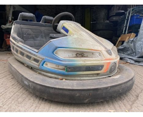 A late 20th Century 1990s fairground / funfair carousel ride / bumper cars ride two seater car having a shaped plastic shell 