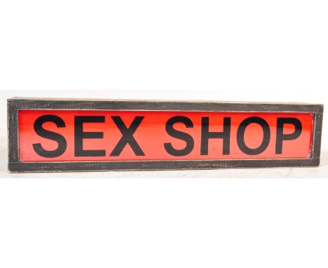 SEX SHOP - A late 20th Century 1990s point of sale shop advertising light box sign reading "Sex Shop". Black lettering on ora