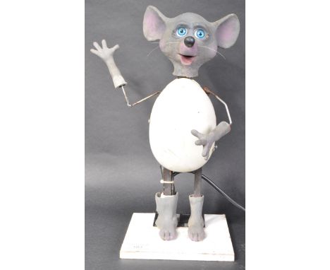 A late 20th Century 1990s scratch built animatronic figure of a mouse. Rubber head, hands and feet with central plastic egg s