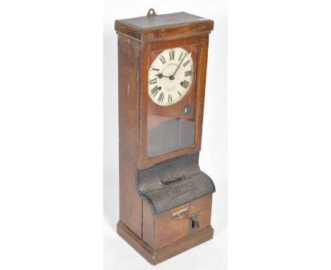 National Time Recorder Co Ltd - A vintage early 20th Century oak cased clocking in and out timepiece having a painted dial wi