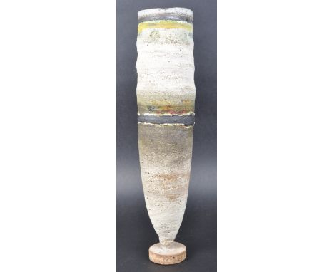 Robin Welch (b.1936) - A retro 20th Century studio art pottery footed vase of tall cylindrical form having earthenware tones 