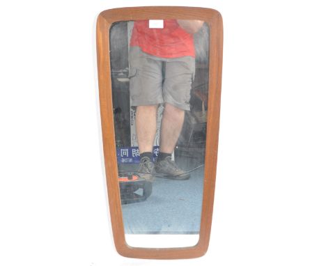 A retro vintage mid 20th Century teak framed hanging mirror of curved rectangular form. Measures approx; 80cm x 36cm.&nbsp;&n