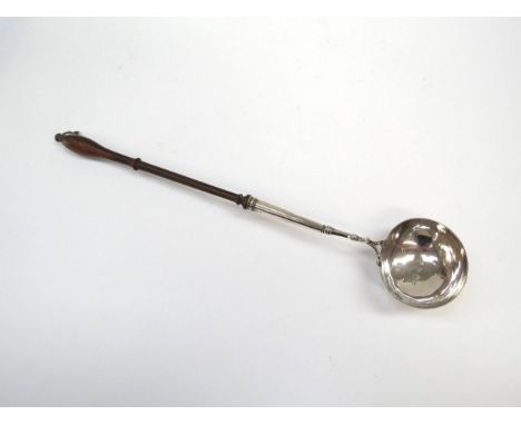 A 19th Century silver toddy ladle, silver bowl and part of shaft joining a turned fruitwood handle, 39cm long
