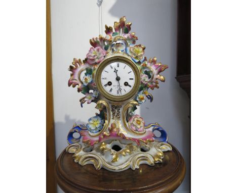 A Paris Ceramic mantel clock with floral detail damage to petals, 32cm tall x 24cm