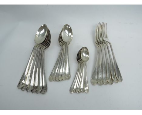 A set of Walker and Hall silver cutlery consisting of six soup spoons, six dessert spoons, six teaspoons and six dinner forks