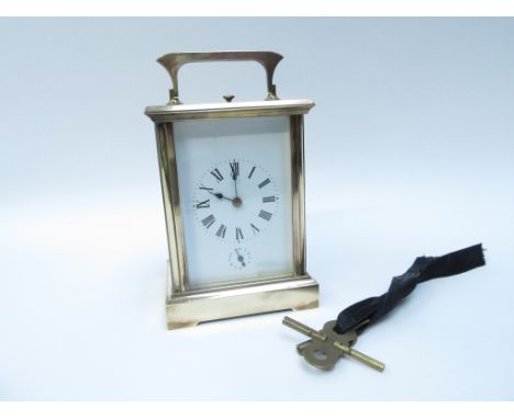 A French repeater carriage clock, enamel face with Roman numeral dial, two keys