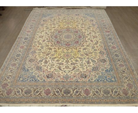 A Persian rug of large proportions, cream ground, multiple borders all over scroll foliate pattern, central medallion, 372cm 