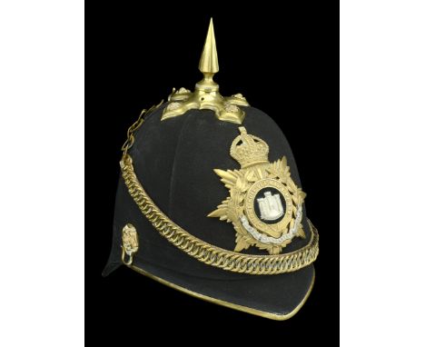 The Devonshire Regiment Officer’s Blue Cloth Helmet c. 1902-14. A good example, the skull complete with all gilt metal fittin