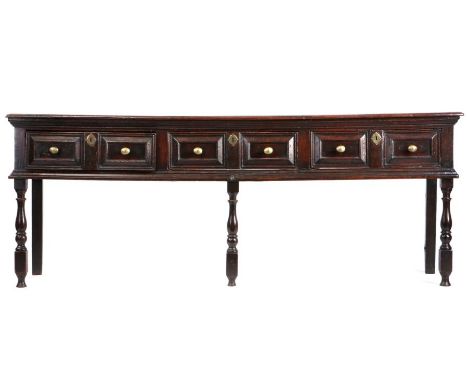                         A good Charles II oak low dresser, circa 1680                        The rectangular top above three 