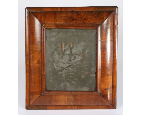 A William & Mary figured-walnut mirror, circa 1690With cushion-moulded frame, moulded slip and border, height 47.5cm, width 4