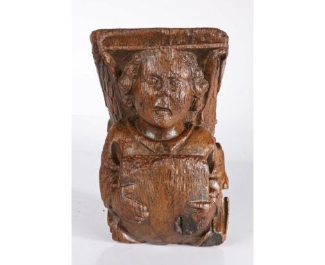 A rare 15th century oak roof angel corbel,  East Anglia, Suffolk or Norfolk, circa 1450Designed from the waist up, with colla