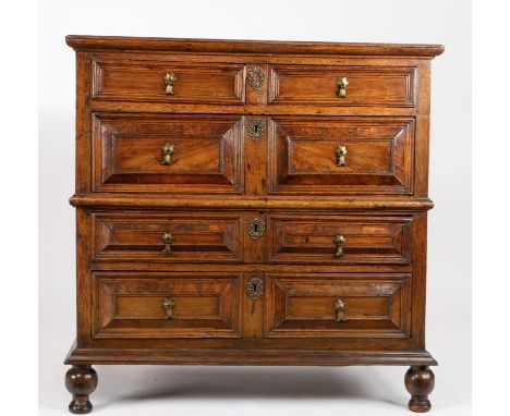 An impressive Charles II walnut and oak chest of drawers, circa 1680The top of two boards with applied moulded edge, over two