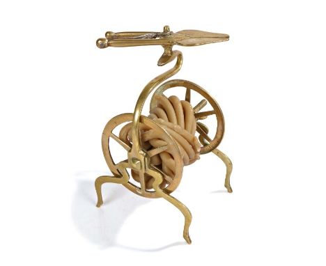 A mid-18th century brass wax-jack or taper holder, Dutch, circa 1750Topped by a pair of nips with steel spring, the taper wou
