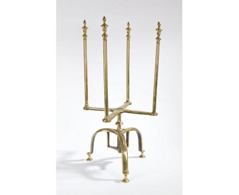 A rare George II brass revolving plate warmer and stand, circa 1750Having four long finial-topped spokes, on a revolving X-fo