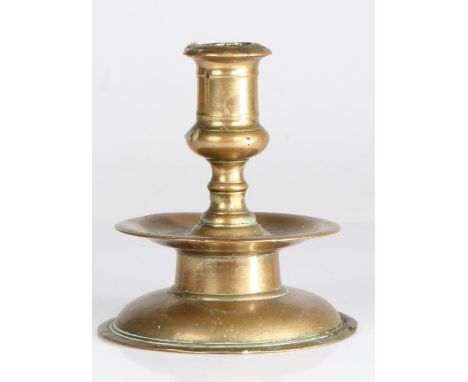 A mid-17th century brass socket candlestick, North-West European, circa 1640The bold straight-sided socket with flared rim an