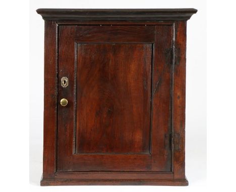 A George III oak mural cupboard, circa 1760Having a single-panelled cupboard door, enclosing one shelf, height 72cm, width 64