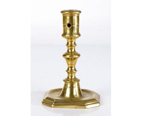 A late 17th century brass candlestick, Flemish, circa 1690

The cylindrical socket with moulded rim and extraction hole, on a