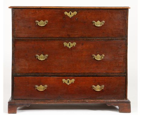 A small George II oak box-top chest, circa 1750


The hinged lid with an applied ovolo-moulded edge, enclosing a deep interio