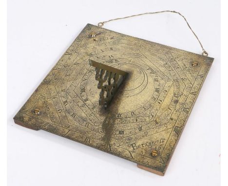 An engraved brass sundial, English, dated 1716With ornate pierced gnomon, the near-square backplate with five concentric time