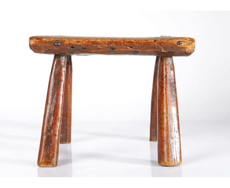 A George III oak and ash primitive ‘table-stool’, circa 1800-20Possibly for a lace makers’ lamp, the single-piece top on four