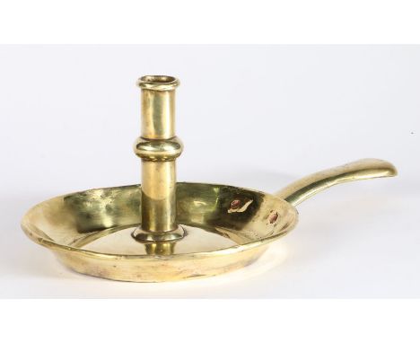 An early 18th century brass ejector candlestick, circa 1700-20The stem centred by a shallow ball-knop, the ejector with an un