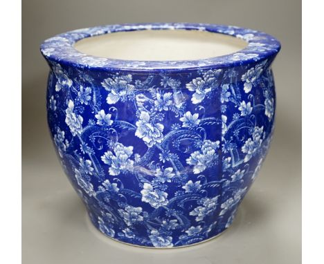 A blue and white ceramic jardiniere, pseudo mark, 27cm high.