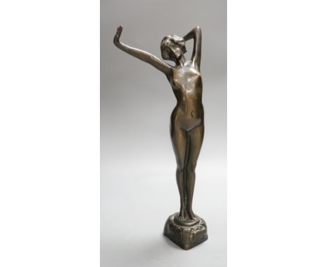 An Art Nouveau style female bronze nude. 39cms high.