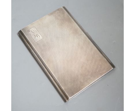 A George V engine turned silver rectangular cigarette case, 12.2cm, with engraved initials.