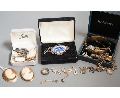 A 9ct mounted oval cameo shell brooch, and other assorted jewellery including, costume, a white metal charm bracelet, 925 ear