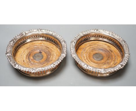 A pair of Regency Old Sheffield plate decanter coasters. 17cm diameter.