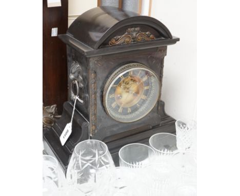 An Edwardian black slate mantel clock, 38cms high,