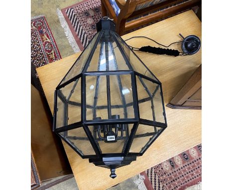 A contemporary octagonal painted metal hall lantern, height excluding chain 84cm