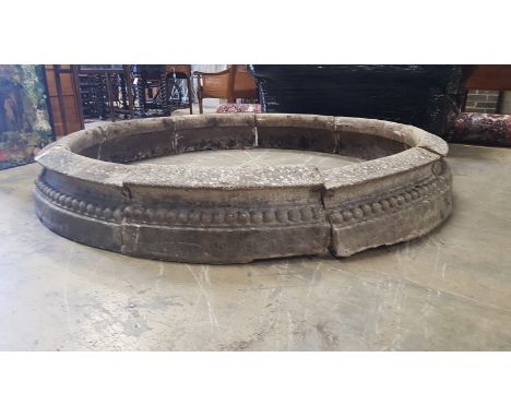 A reconstituted stone circular sectional garden planter, each segment width 68cm, height 28cm