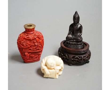 A Chinese resin snuff bottle, a resin Buddha on stand and a resin netsuke