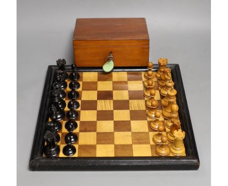A late 19th / early 20th century weighted Staunton chess set, red crown stamps, kings 7.5cm, with inlaid chess board 32cm
