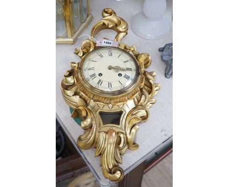 A Swedish giltwood cartouche shaped cartel wall clock, 58cms high,