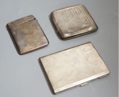 A George V engine turned silver cigarette case, 11.4cm, one other silver cigarette case and a silver card case with damaged l