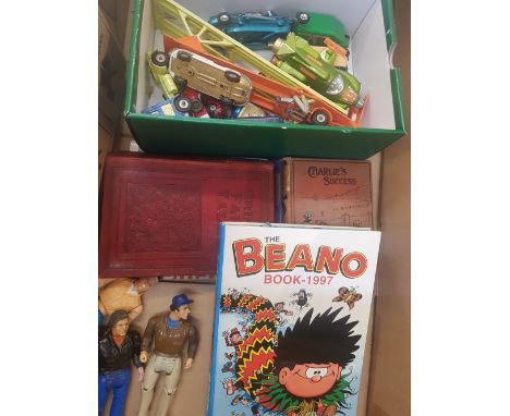 A mixed collection of items to include Toy figures, dinky toy car examples, the beano book 1997 etc (1 box)