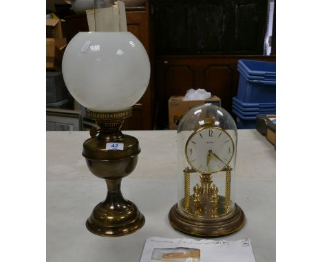 Brass effect Valor oil lamp with shade and funnel together with Bentima glassed domed clock , height of tallest 52cm (2) 