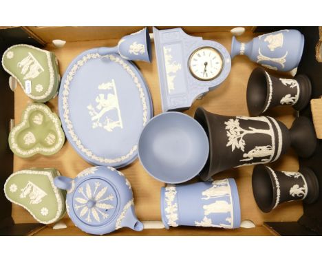 A large collection of Wedgwood Jasperware items include Mantle clock, lidded boxes, vases, teapot(a/f) etc 